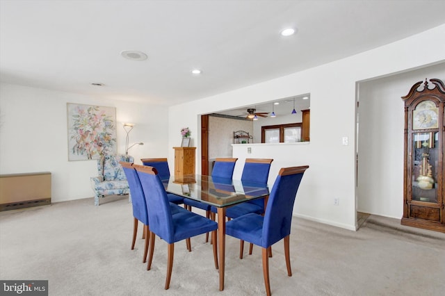 dining room with light colored carpet