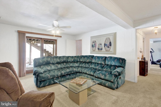 carpeted living room featuring ceiling fan