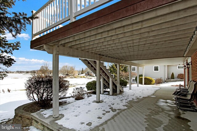 view of snow covered patio