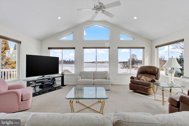 carpeted living room featuring ceiling fan