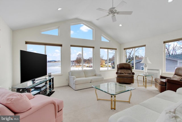 living room with ceiling fan, light colored carpet, and lofted ceiling