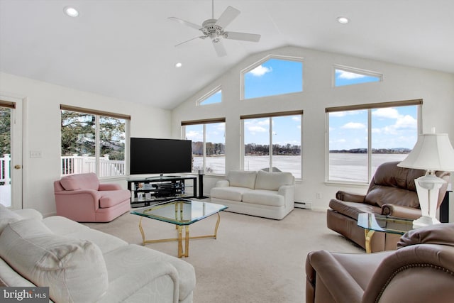 carpeted living room featuring a baseboard heating unit, vaulted ceiling, and ceiling fan