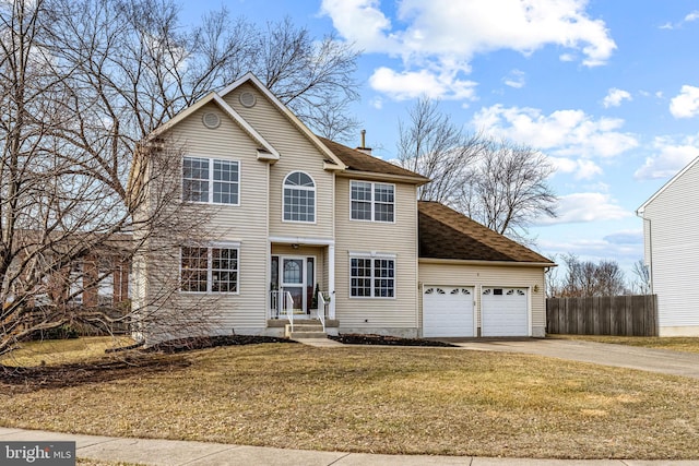 view of front facade with a garage and a front yard