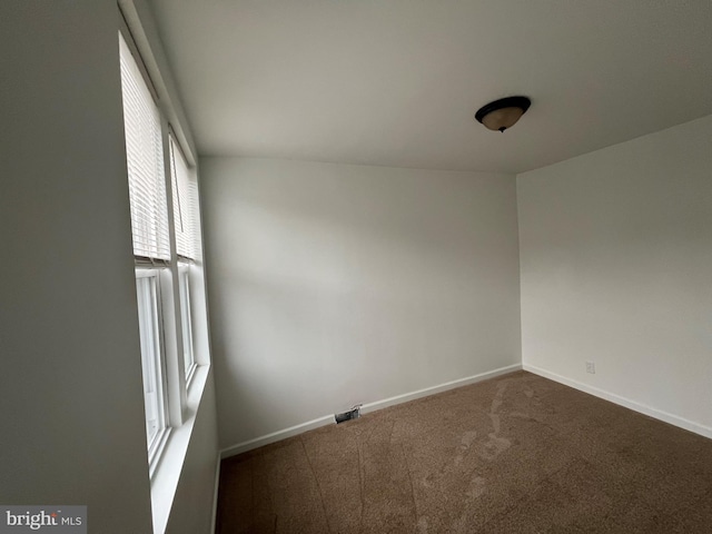 empty room featuring carpet floors