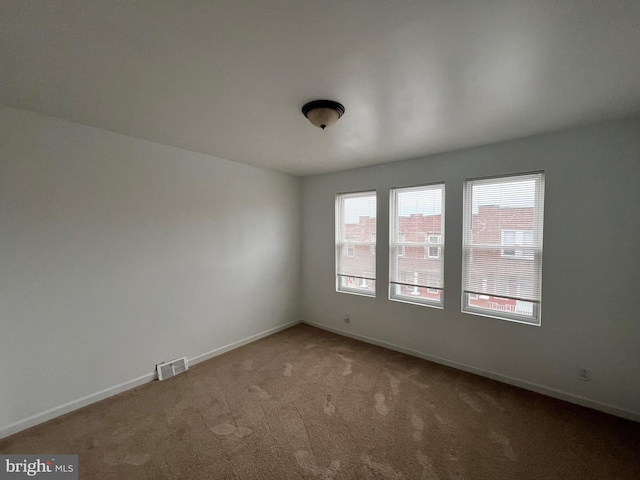 unfurnished room featuring carpet floors