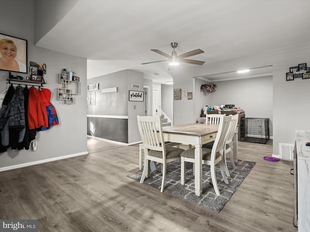 dining space featuring hardwood / wood-style floors and ceiling fan