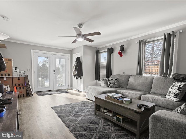 living room featuring french doors, ceiling fan, ornamental molding, and hardwood / wood-style flooring