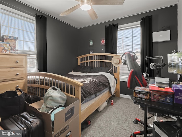 carpeted bedroom with ceiling fan