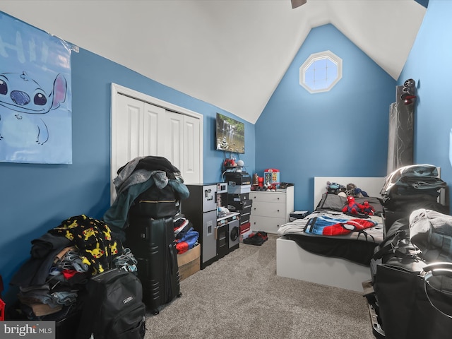 bedroom with lofted ceiling, carpet floors, and a closet