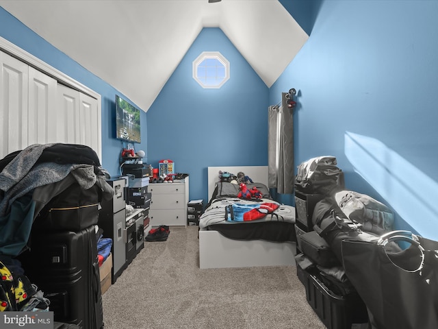 carpeted bedroom with vaulted ceiling