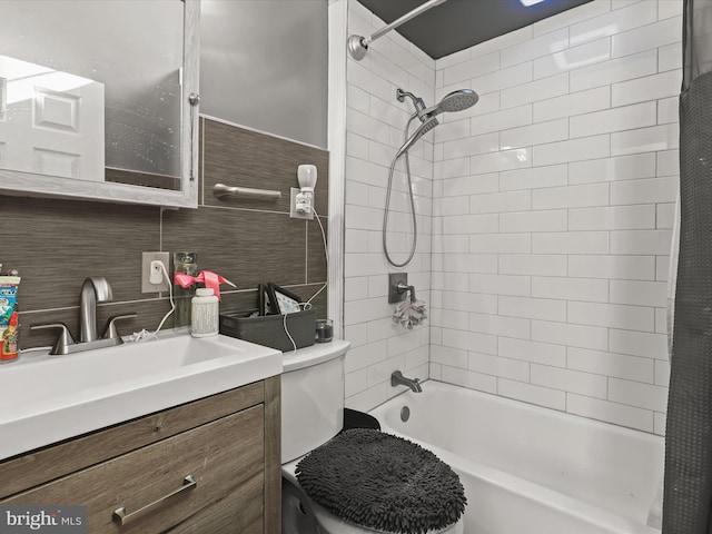 full bathroom featuring tasteful backsplash, vanity, shower / bathtub combination with curtain, and toilet