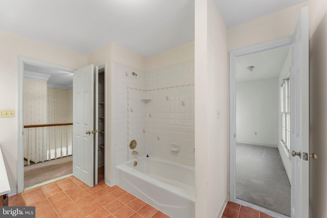 bathroom with tile patterned flooring, baseboards, and shower / tub combination