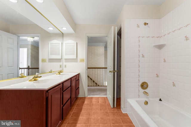 full bath with double vanity, a sink, shower / tub combination, and tile patterned floors