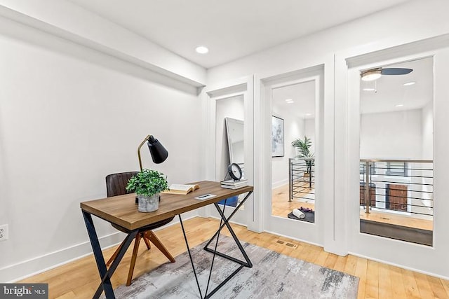 office space with hardwood / wood-style flooring