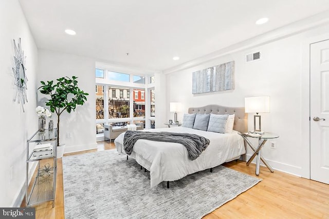 bedroom with wood-type flooring