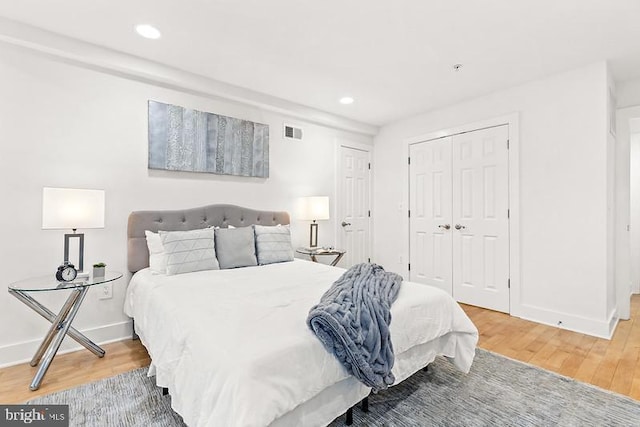 bedroom with hardwood / wood-style flooring