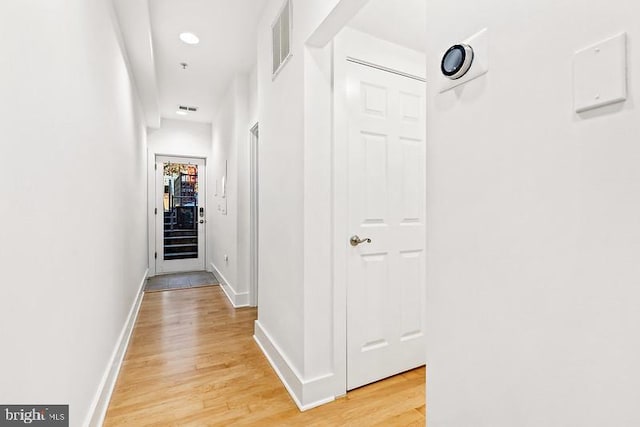 hall featuring light hardwood / wood-style floors