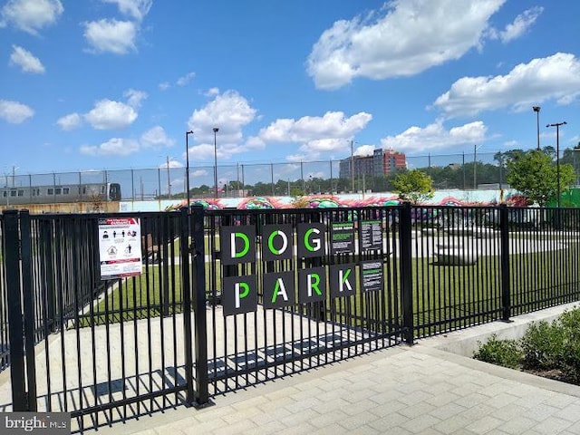 view of gate featuring a yard