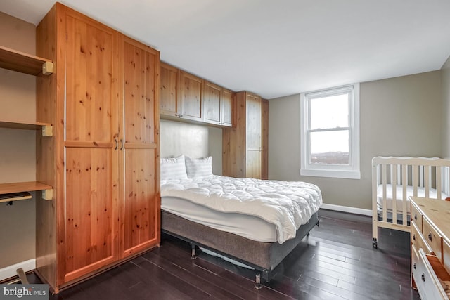 bedroom featuring dark wood-type flooring