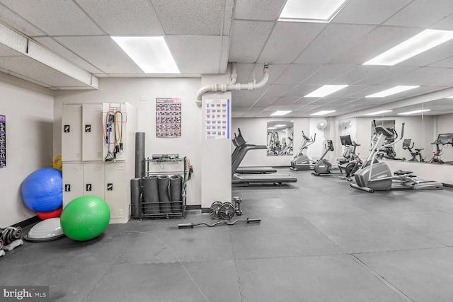 exercise room with a drop ceiling