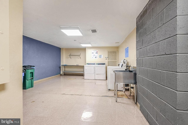 laundry area featuring sink and washing machine and dryer