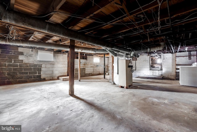 basement with washer / dryer and heating unit