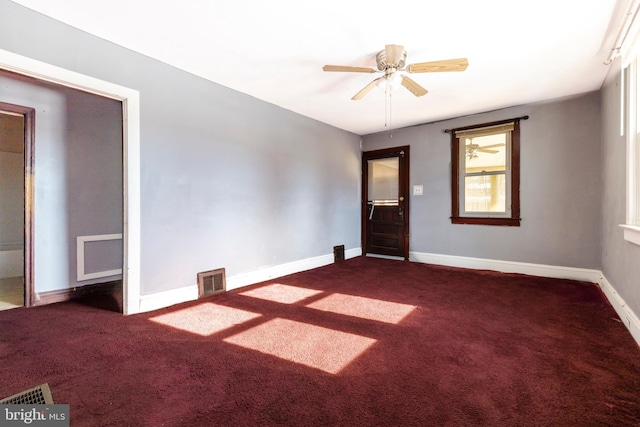 carpeted empty room with ceiling fan