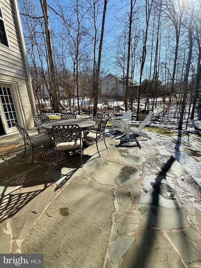 view of snow covered patio