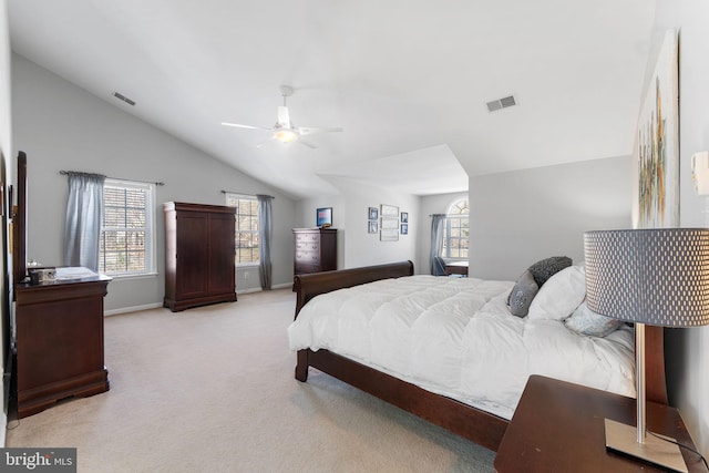 carpeted bedroom with vaulted ceiling and ceiling fan