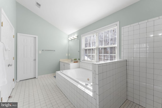 bathroom featuring lofted ceiling, vanity, tile patterned floors, and plus walk in shower