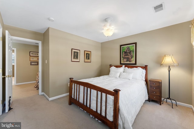 bedroom featuring light colored carpet