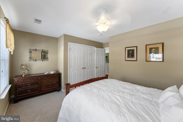 carpeted bedroom featuring a closet