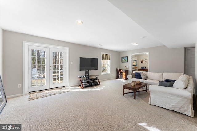 carpeted living room featuring french doors