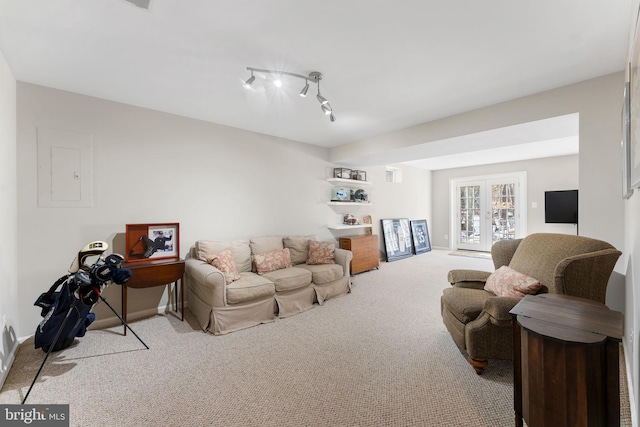 living room with light colored carpet, french doors, and electric panel