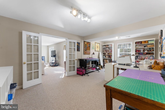 interior space with carpet flooring and french doors