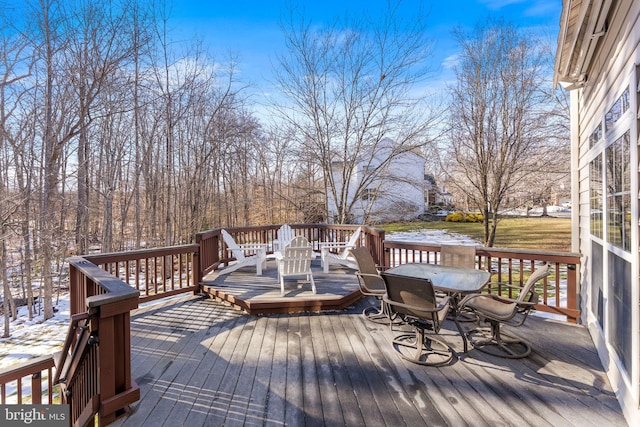 wooden terrace featuring a water view