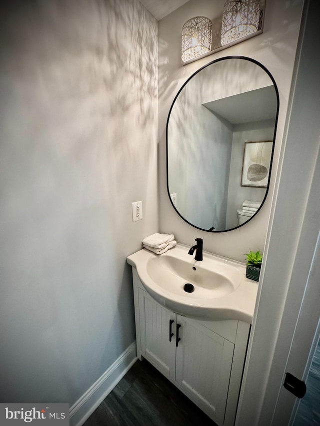 bathroom featuring vanity and hardwood / wood-style flooring