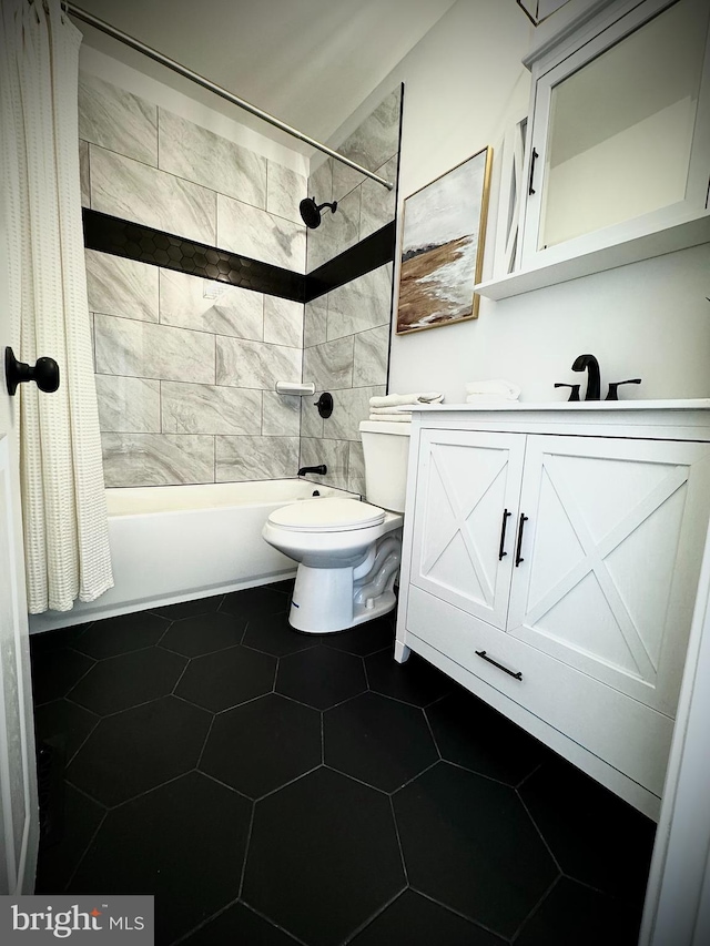 full bathroom featuring shower / tub combo, vanity, tile patterned flooring, and toilet