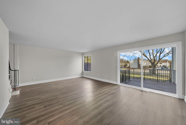 empty room featuring dark hardwood / wood-style floors