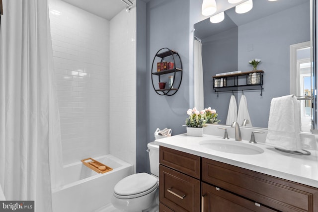 full bathroom featuring vanity, shower / bathtub combination with curtain, and toilet