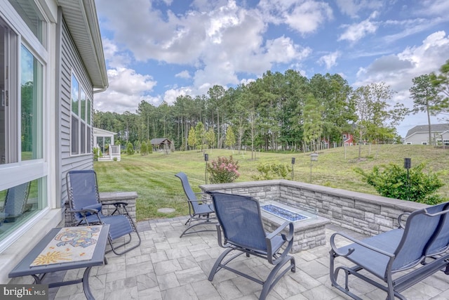 view of patio / terrace with a fire pit