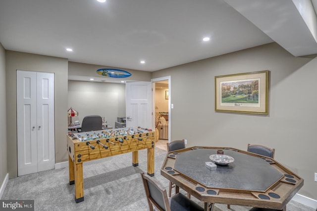 game room featuring light colored carpet