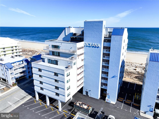 bird's eye view with a water view and a view of the beach