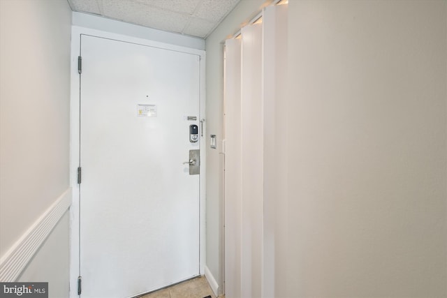 entryway featuring a drop ceiling