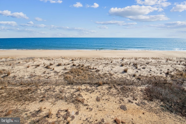 property view of water featuring a beach view