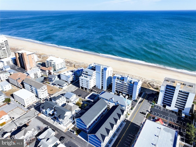 bird's eye view with a view of the beach and a water view