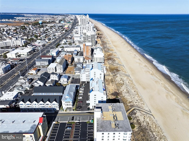 bird's eye view with a view of the beach and a water view