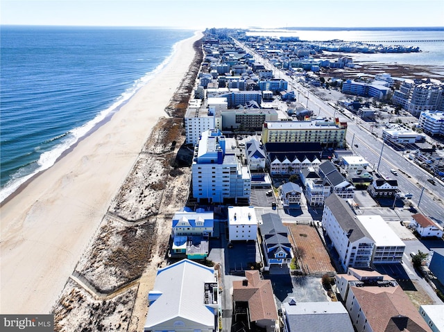 bird's eye view featuring a water view and a view of the beach