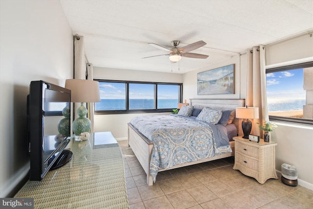 bedroom featuring tile patterned flooring and ceiling fan