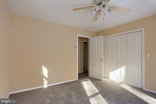 unfurnished bedroom with carpet flooring, ceiling fan, and a closet